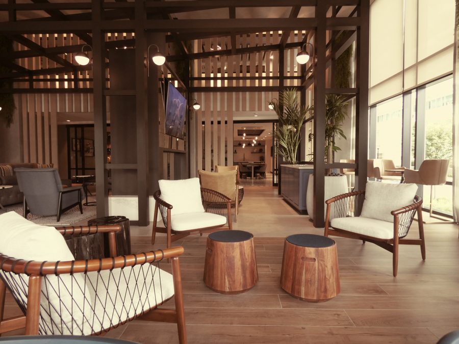 Amenity lounge with wood screens and seating