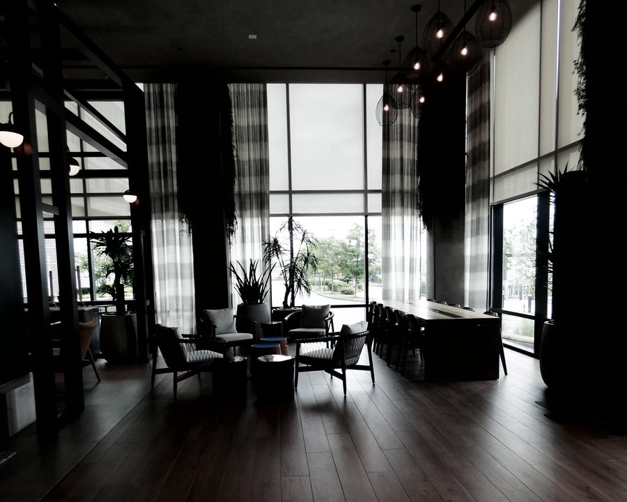 Clubroom at dusk with floor-to-ceiling glass